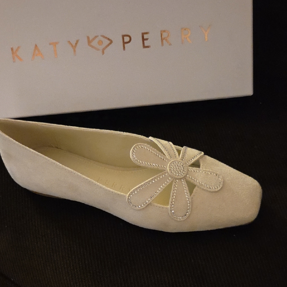 Katy Perry Collections Cream Flats with Floral Accent.With a heel height of less